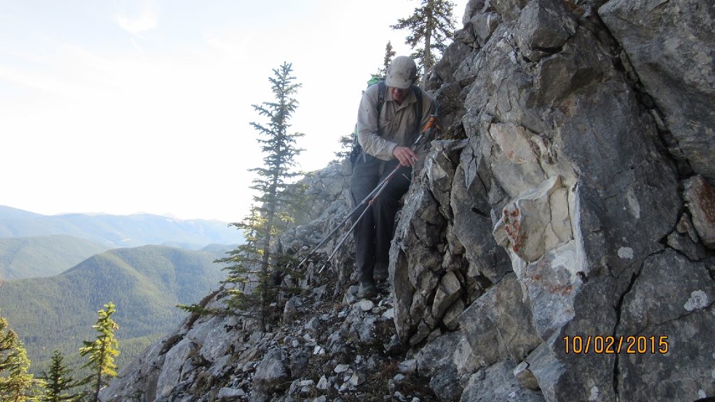 Narrow ledge around small peak