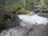 Across this creek and trail is on the right