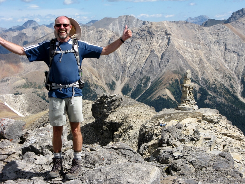 Bill at cairn Sawback Range behind